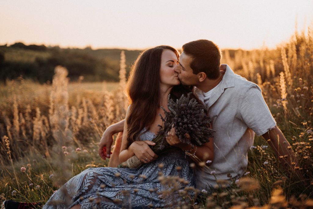 Couple sitting in the field, golden hour, couple photograph